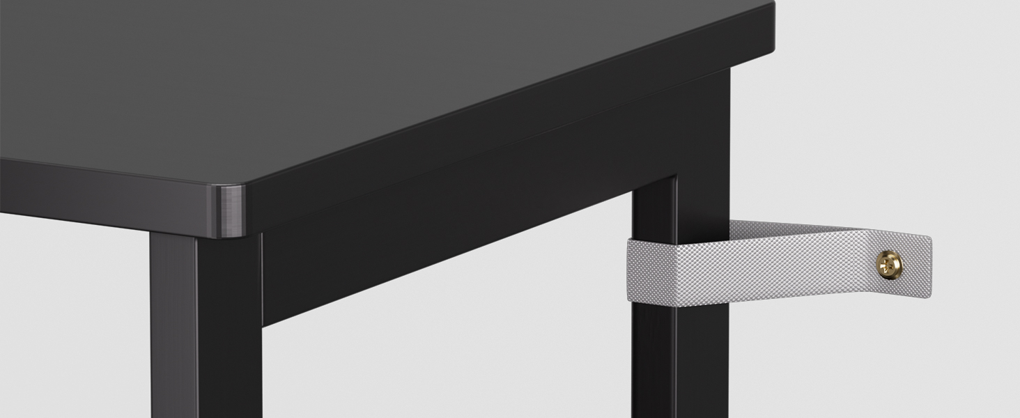 a close up of a black dining table with a metal base.
