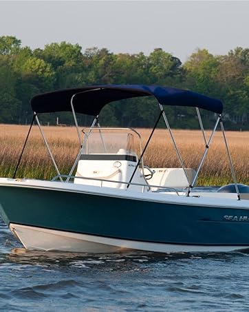 boat with navy bimini boat top installed