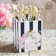 striped floral pen holder holding gem topped pens