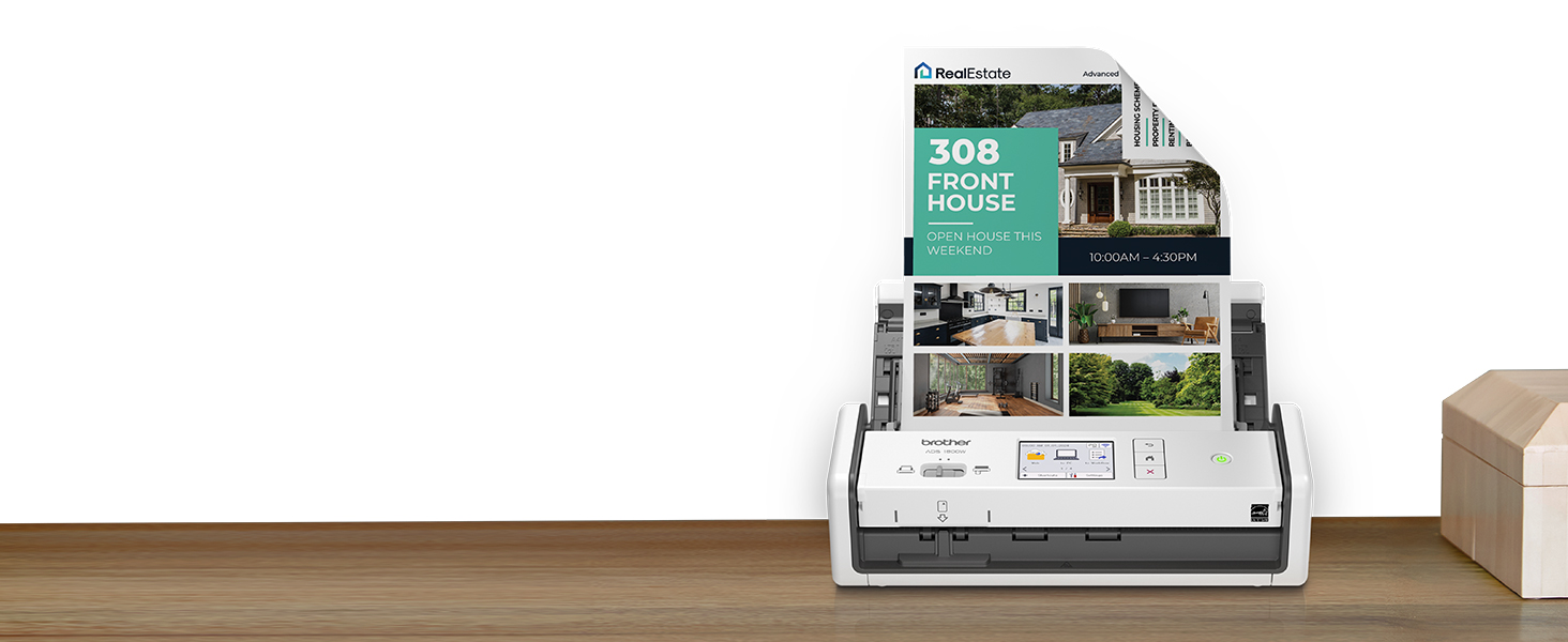 Brother ADS1800W compact scanner on desk, with double-sided open house flyer in document feed