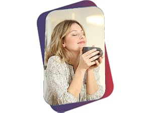 Woman holding cup of tea, happy.