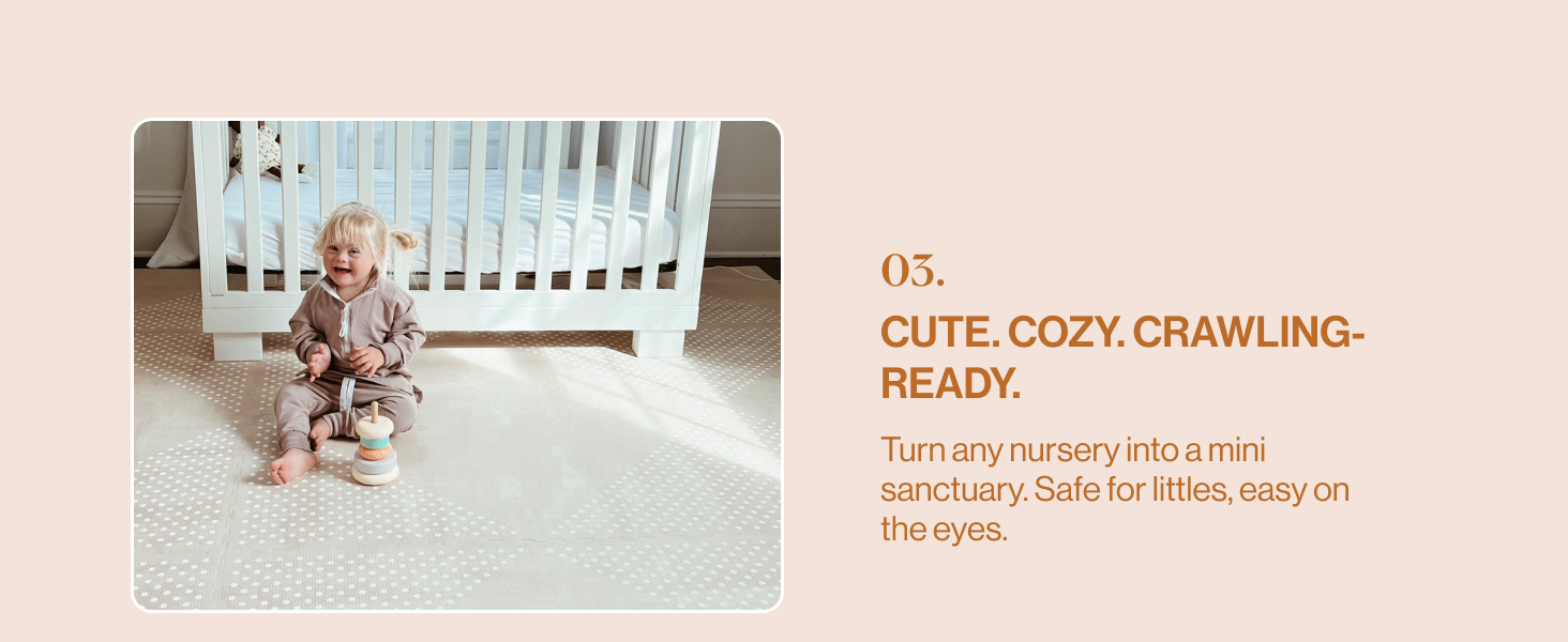Toddler sitting on mat in nursery.