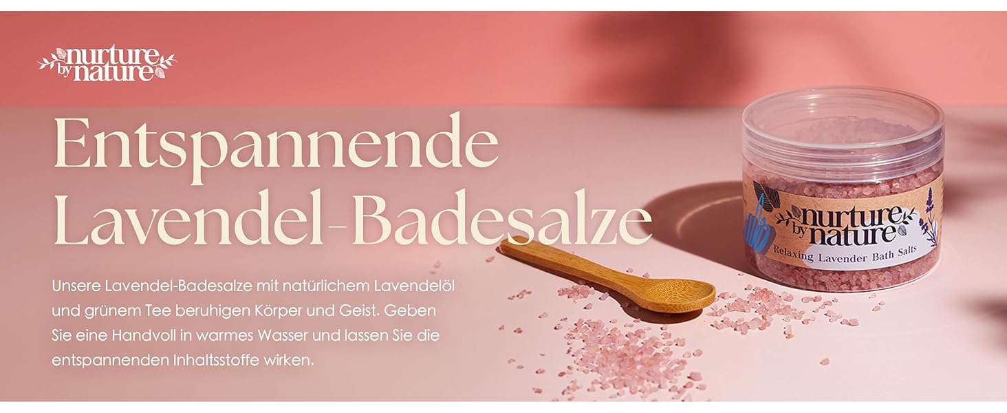 a wooden spoon on a pink table with a spoon on it.