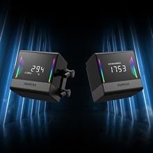 Two black cube-shaped digital devices with bright LED displays showing numbers. One reads '29.4' and the other '17.53', set against a dark background with blue light streaks.