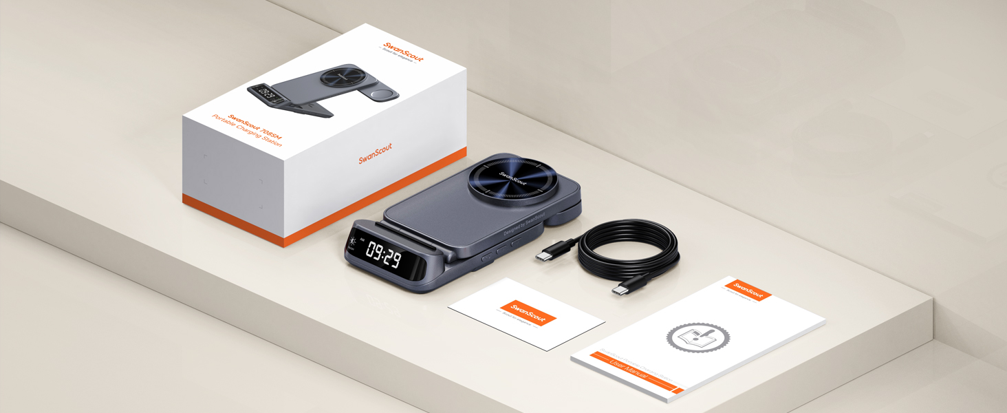 Kabelloses Ladepad mit Digitalanzeige, inklusive Verkaufsverpackung, USB-Kabel und Bedienungsanleitung. Dunkelgraues rundes Gerät auf weißer Oberfläche.