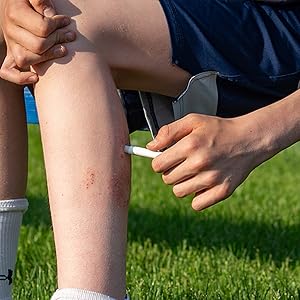 Applying DuraDerm SPORT Stick on leg