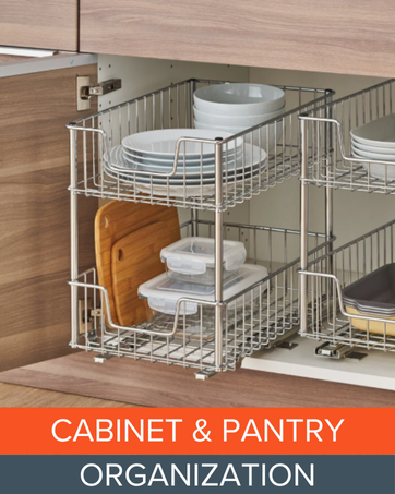 Metal pull-out cabinet organizers holding plates, cutting boards, and food containers
