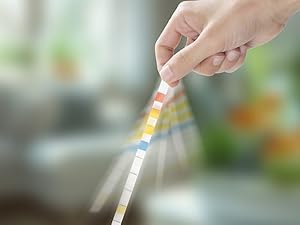 Shake off the water on the test paper