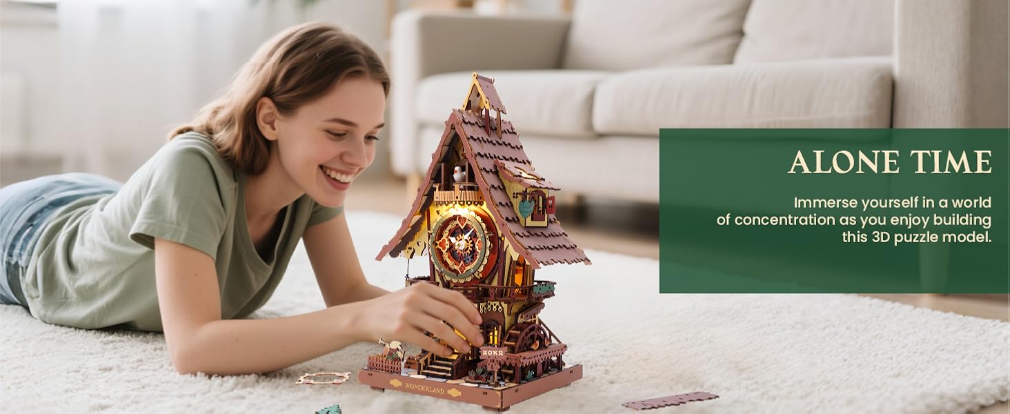 Text reads 'ALONE TIME'. Person lying on floor with decorative gingerbread house display
