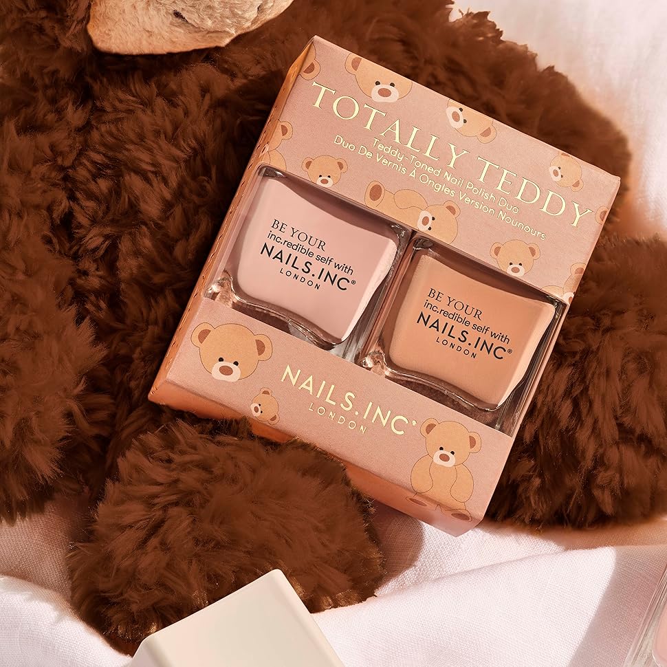 nail polish duo and two single polishes on top of a teddy bear