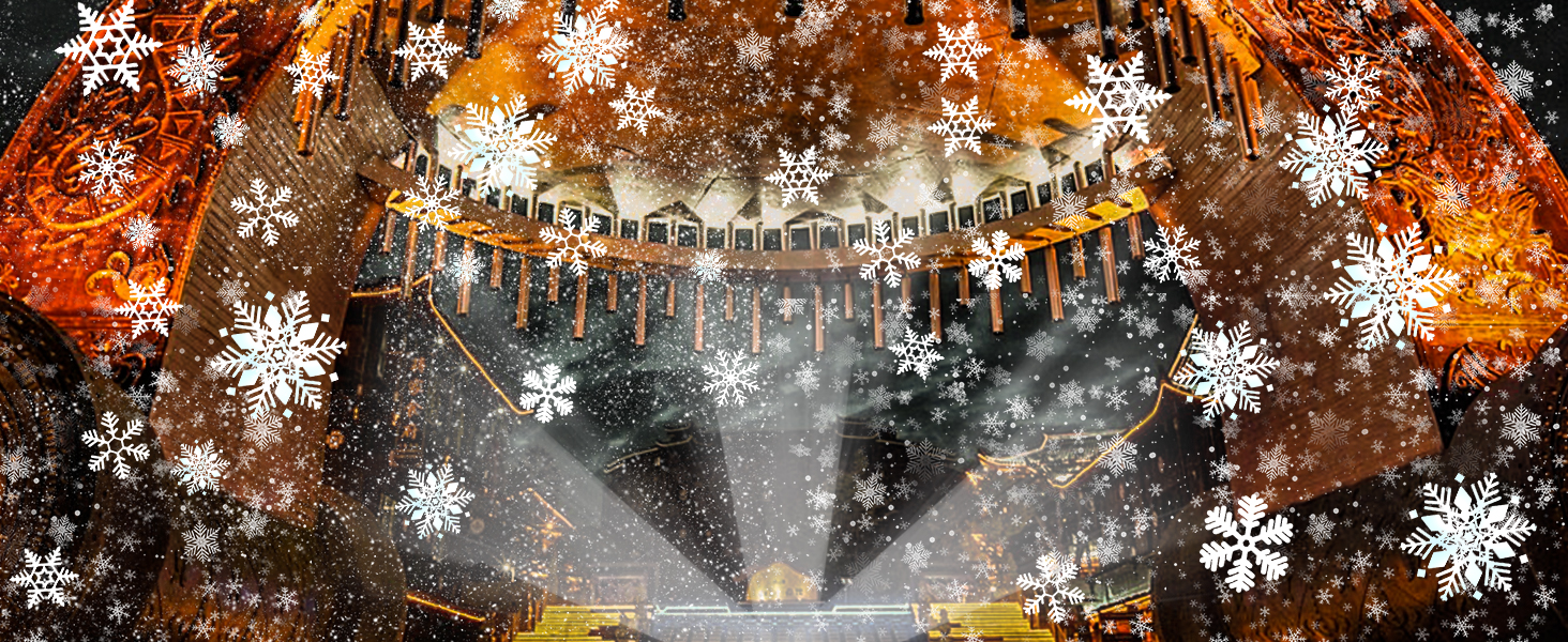 Festive winter scene with hanging string lights and large snowflake decorations against a dark background with warm glowing effects.
