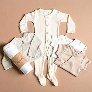 styled flat lay image of neutral color essentials from l'ovedbaby