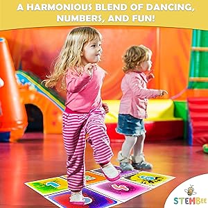 two children playing musical dancing games with liquid sensory tiles