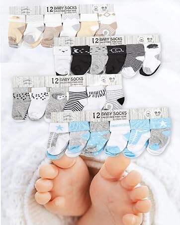 Assortment of baby socks in various colors and patterns, displayed in packages of 12 pairs each. Infant feet visible at bottom.