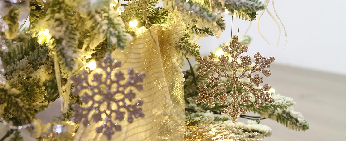 Champagne glitter snowflake ornaments on a Christmas tree