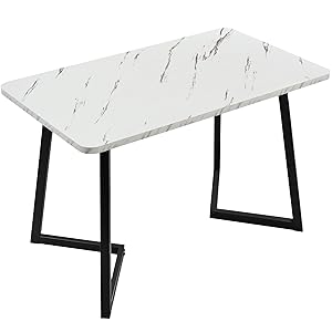 Rectangular dining table with white marble-effect top and black metal legs in a minimalist design.