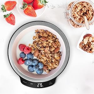 a bowl of granola with berries and nuts