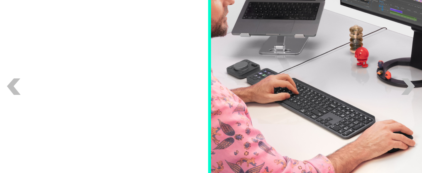 a man working on a computer using mx master 4 ergonomic wireless mouse