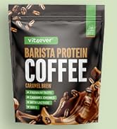 Le texte indique « CAFÉ PROTÉINÉ BARISTA ». L'emballage du produit montre des grains de café noirs avec des accents verts sur fond noir.