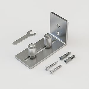 Assembly sequence showing metal mounting brackets and hardware being connected or installed on a gray surface.