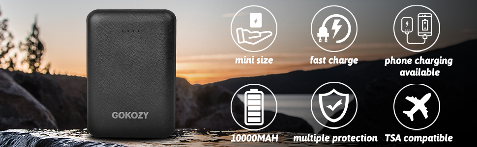 Black portable charger with icons indicating mini size, fast charge, phone charging, 10000mAh capacity, multiple protection, and TSA compatibility. Outdoor scene in background.