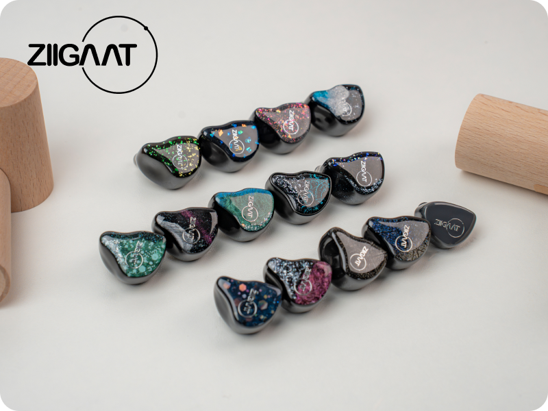 Text reads 'ZIIGANAT'. Collection of sunglasses with marbled pattern frames displayed in a row against beige background.