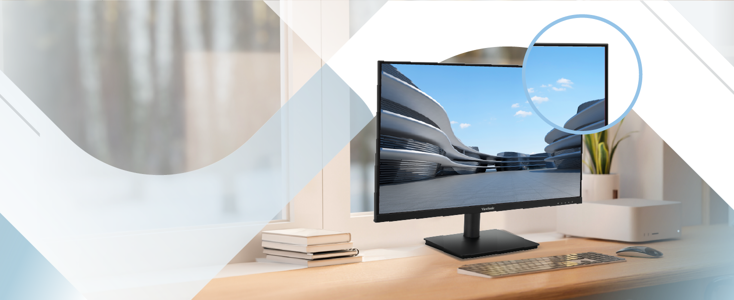 Modern desktop setup with a slim, frameless monitor displaying a nature scene. White desk with plant, notebook, and partial view of circular mirror.