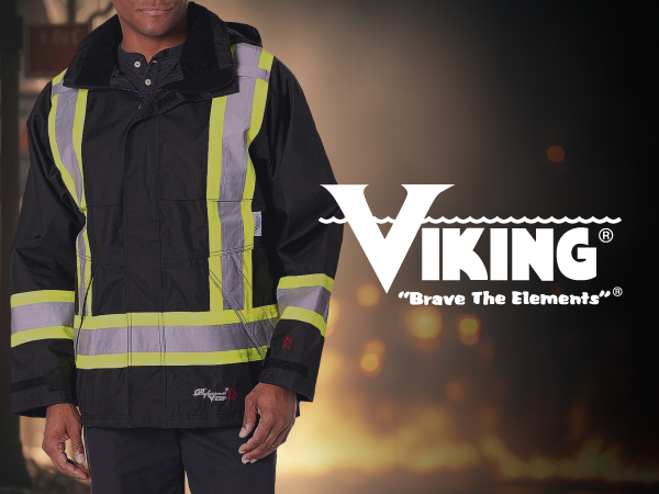 Viking Brave the Elements man wears fire-resistant Journeyman jacket with flames in backdrop