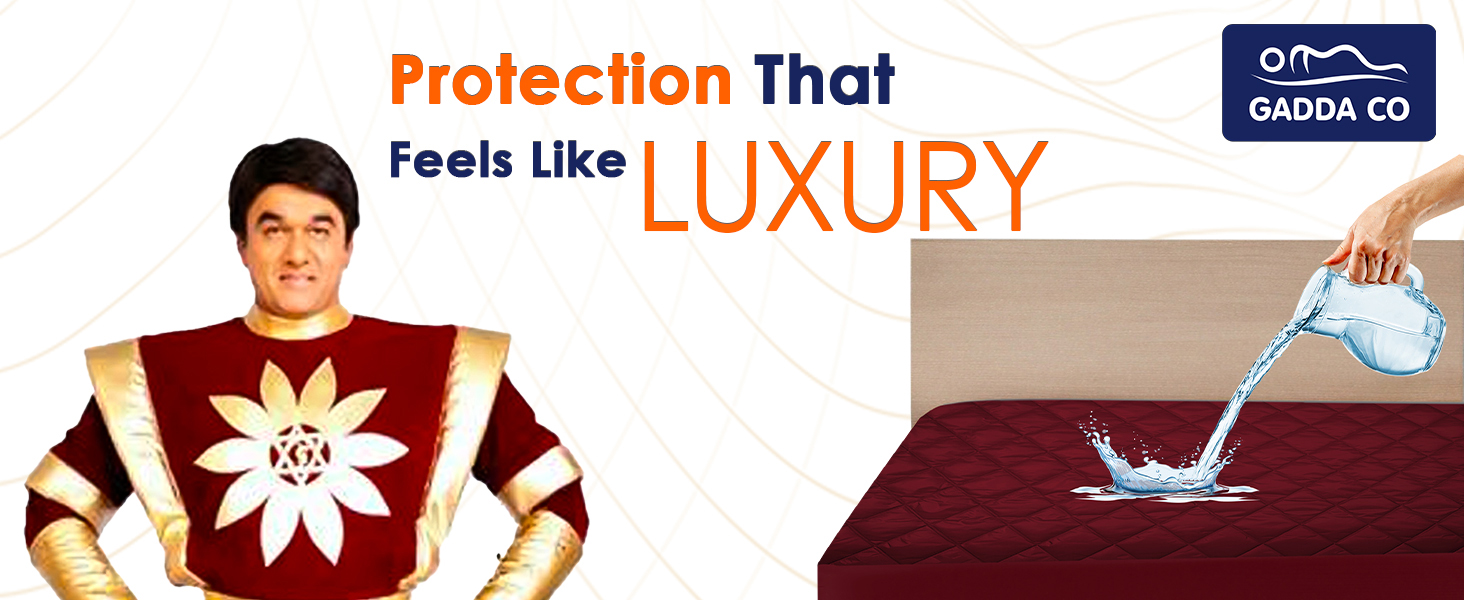 Mukesh Khanna sitting beside bed with quilted mattress protector, water being poured.
