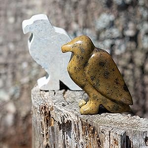 Raw stone soapstone eagle and sculpture on tree