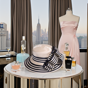 A stylish product displayed on a wooden table with a vase of fresh flowers.