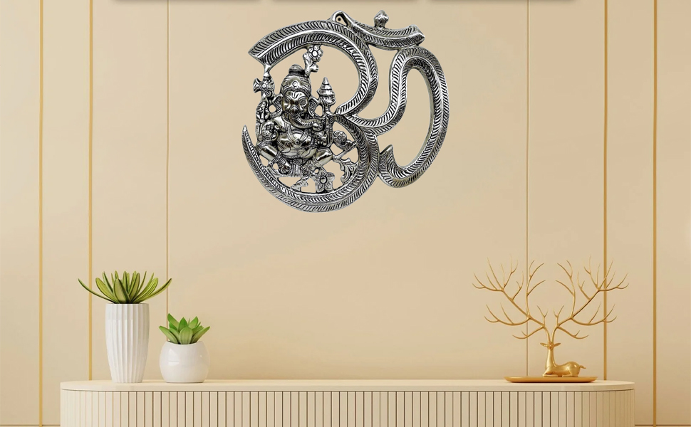 A serene indoor scene with a decorative wall hanging featuring intricate metalwork in the shape of 