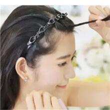 Twist the removed hair a few times. 