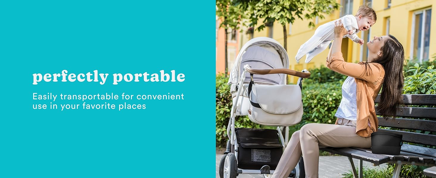 woman sitting on bench holding baby