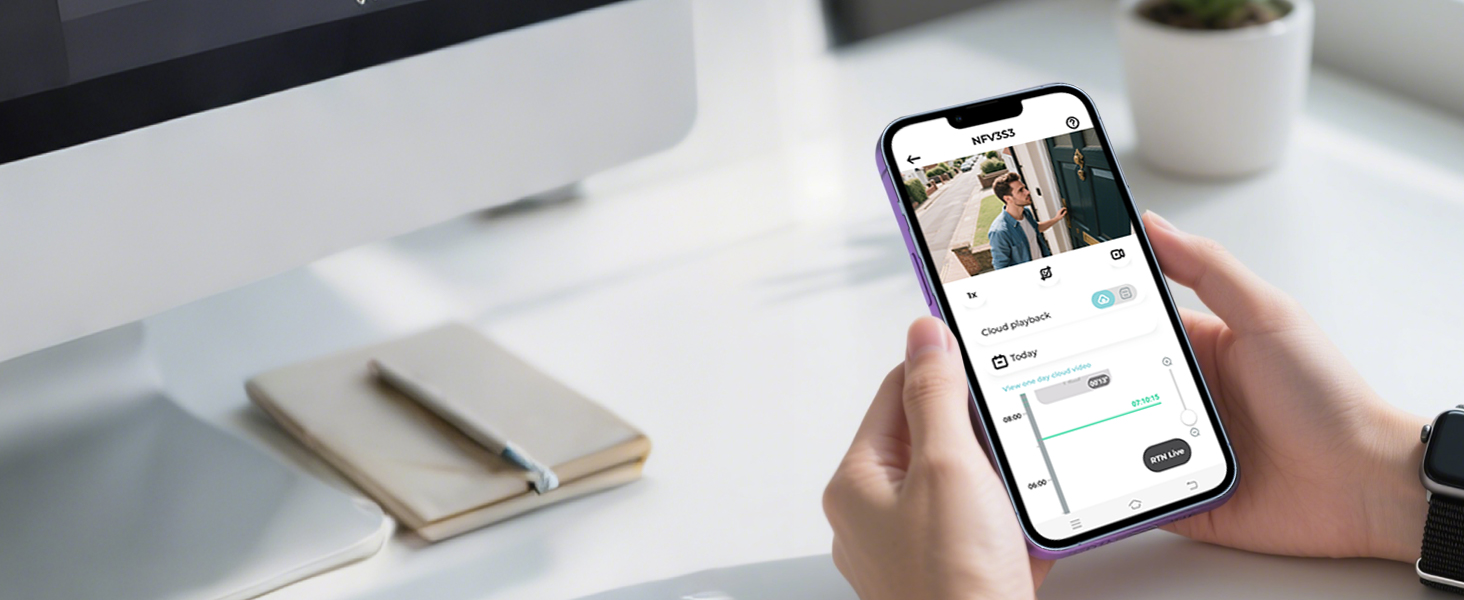 Hands holding a smartphone displaying a social media app interface with a photo post and engagement metrics. A computer monitor, coffee cup, and notebook are visible in the background.