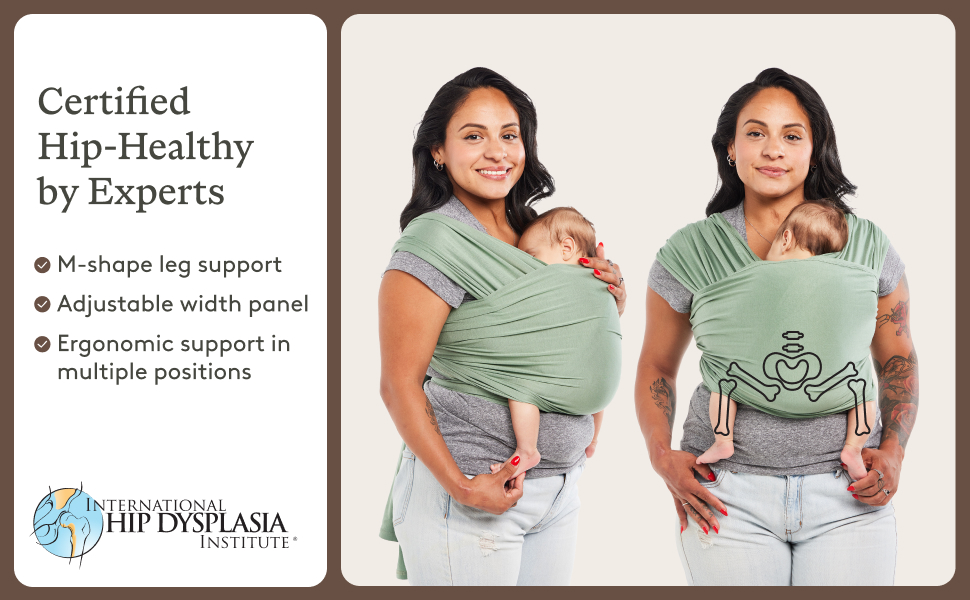 Mom wears baby in carrier with hip support graphic and International Hip Dysplasia Institute badge.