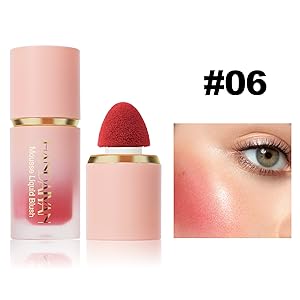 Makeup set featuring pink cylindrical containers with gold accents. Includes liquid and powder products. Close-up of eye with pink-toned makeup applied.