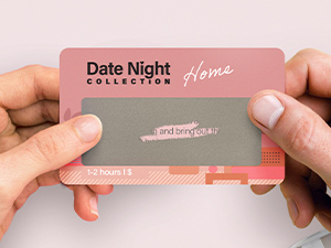 couple holding a scratch off card for date night idea.