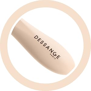 Objet cylindrique beige avec le texte « DESSANGE » imprimé en noir, centré dans une bordure circulaire pâle