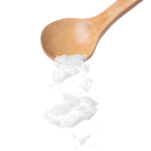 Light wooden or bamboo spoon against a white background.