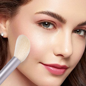 Model using blush brush