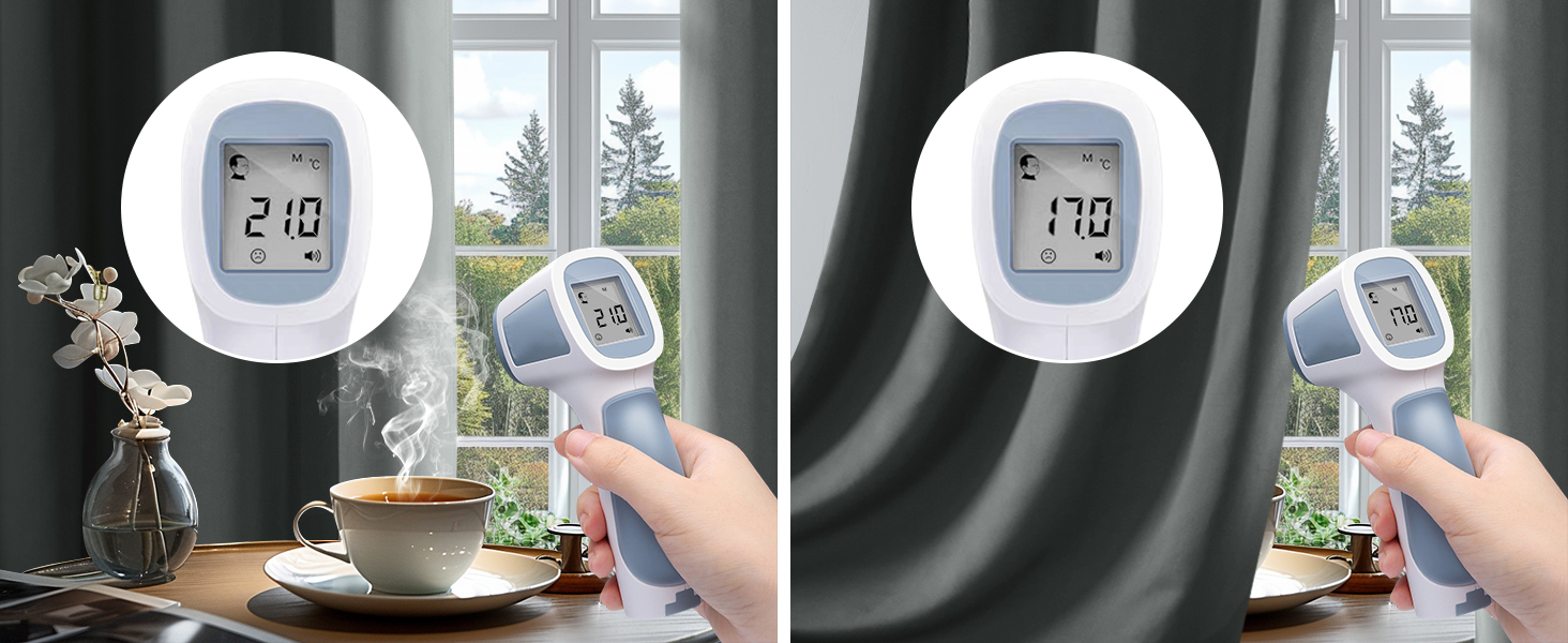 Digital thermometer with round white display showing temperature reading of 21.0 degrees, demonstrated in home setting near window.
