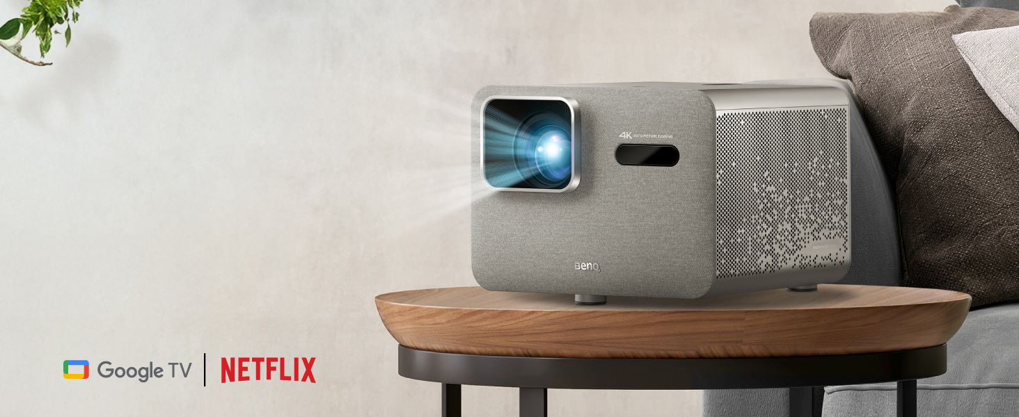 BenQ TK705i 4K HDR home entertainment projector on table in living room