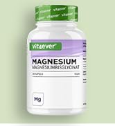 Le flacon blanc étiqueté « MAGNÉSIUM » sur fond vert clair semble être un supplément ou un contenant de vitamines.