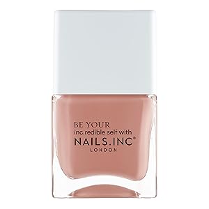 single brown nail polish with white cap
