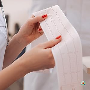 Woman holding ECG print-out strip