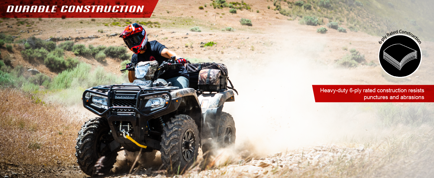 ATV riding on rocky terrain with 6-ply tires built to resist punctures, abrasions, and damage