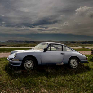 An old Porsche in a field