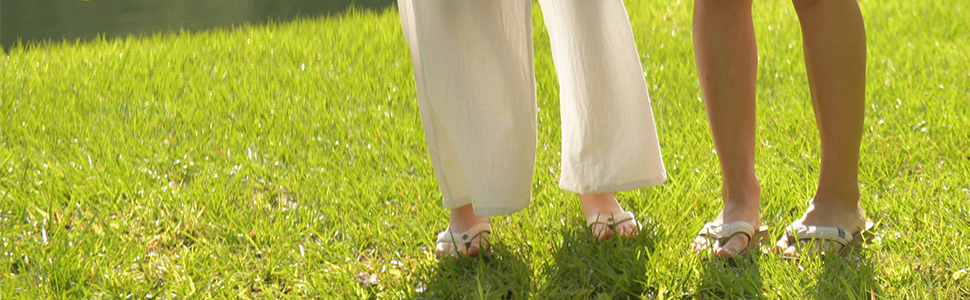 Close-up of two women walking in Cobian Sandals