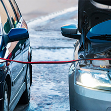 a car being charged with a battery